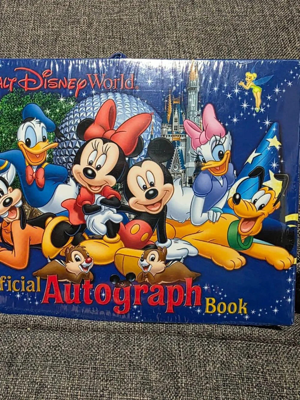 Sealed Walt Disney World Official Autograph Book with classic characters.
